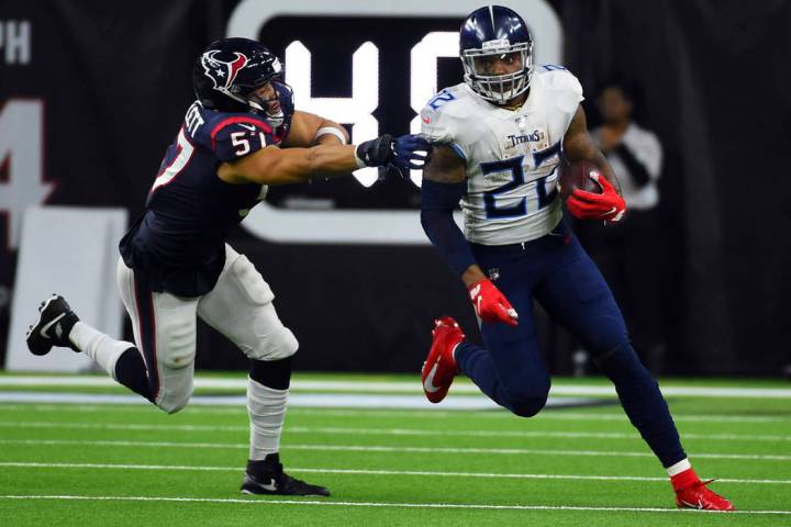 Tennessee Titans running back Derrick Henry (22) breaks away from Houston Texans outside lineba ...