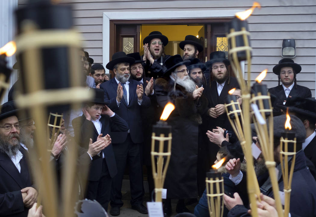 Community members celebrate the arrival of a new Torah at Chaim Rottenberg residence, Sunday, D ...