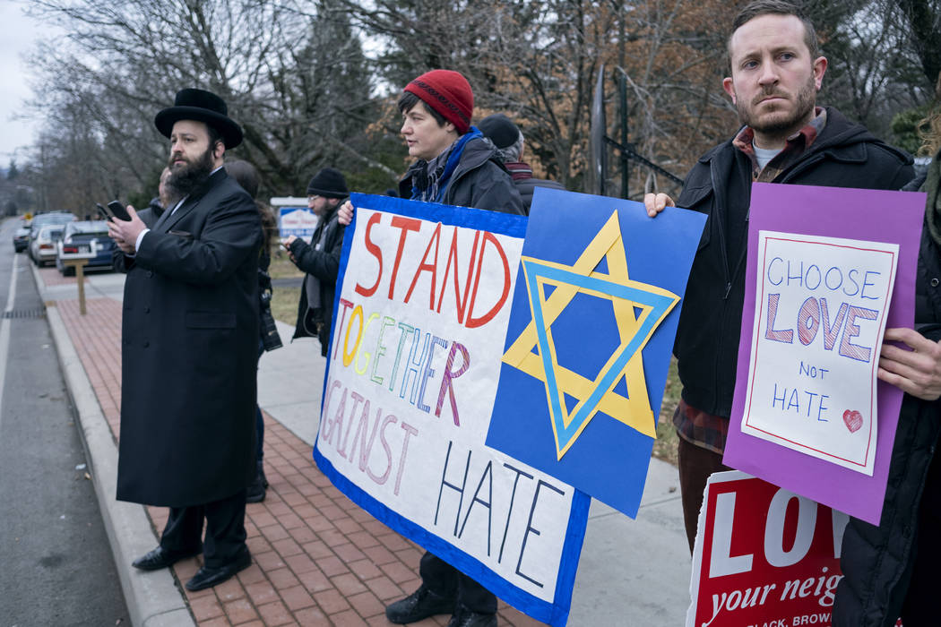 Neighbors gather to show their support of the community near a rabbi's residence in Monsey, N.Y ...