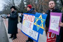 Neighbors gather to show their support of the community near a rabbi's residence in Monsey, N.Y ...