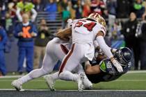 Seattle Seahawks tight end Jacob Hollister (48) is stopped just short of the goal line by San F ...