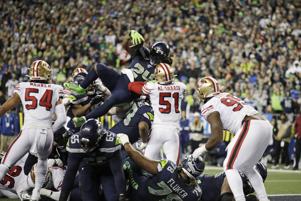 Seattle Seahawks' Marshawn Lynch (24) scores a touchdown on a 1-yard rush against the San Franc ...