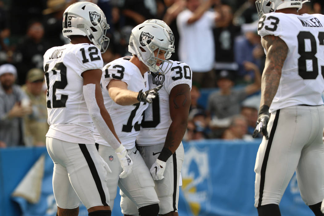 Oakland Raiders wide receiver Hunter Renfrow (13) celebrates his touchdown with wide receiver Z ...