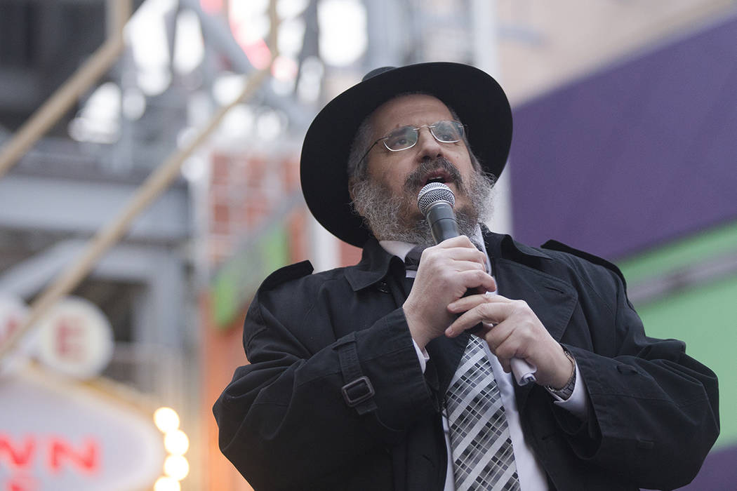 Rabbi Shea Harlig addresses the crowd at a menorah lighting hosted by the Chabada of Southern N ...