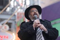 Rabbi Shea Harlig addresses the crowd at a menorah lighting hosted by the Chabada of Southern N ...