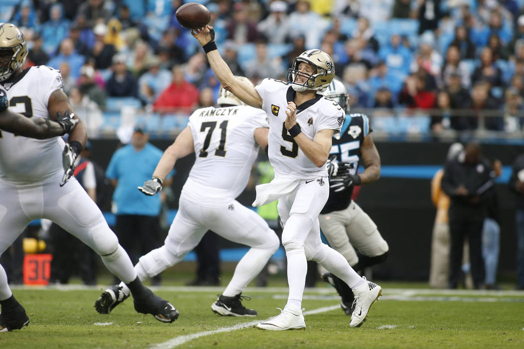 New Orleans Saints quarterback Drew Brees (9) passes against the Carolina Panthers during the f ...