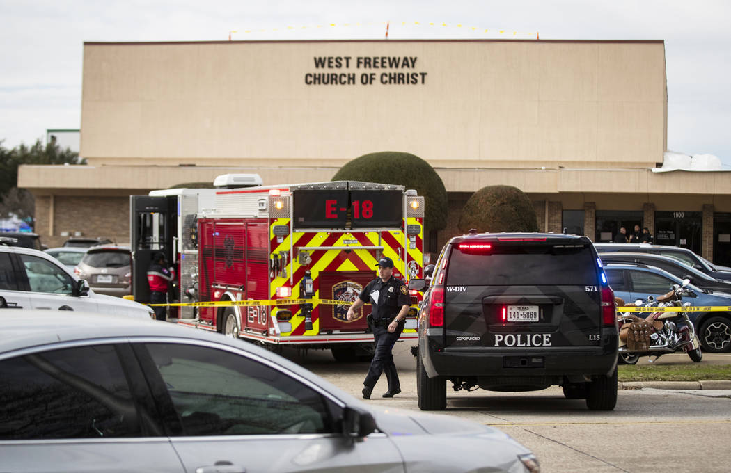 Police and fire departments surround the scene of a shooting at West Freeway Church of Christ i ...