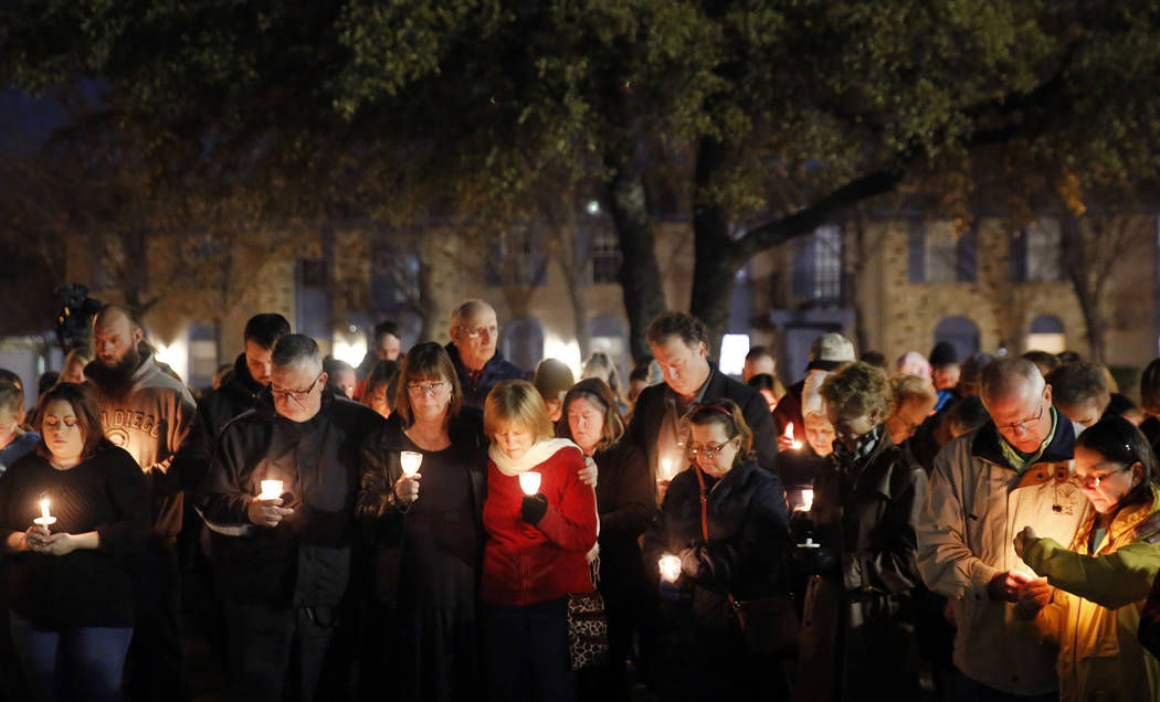 Church and community members gather outside West Freeway Church of Christ in White Settlement, ...