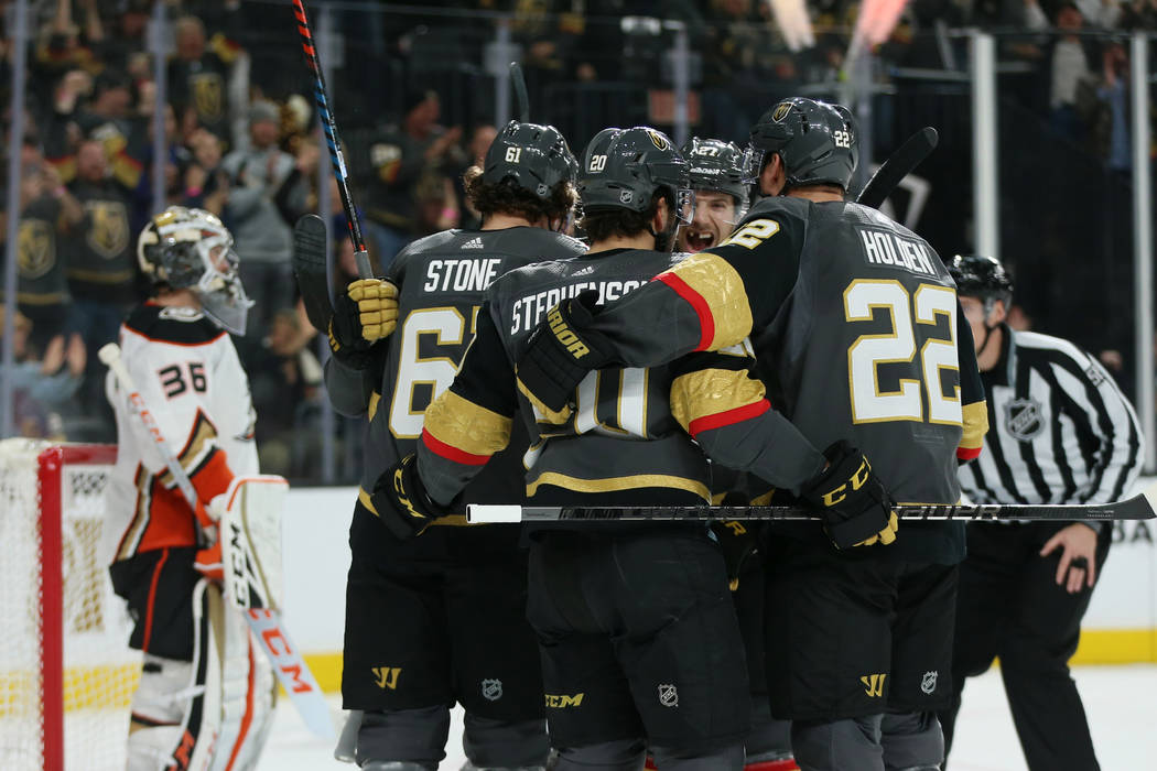 Vegas Golden Knights celebrate a score by right wing Mark Stone (61) during the first period of ...