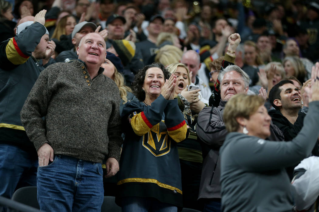 Fans celebrate a score by Vegas Golden Knights center Jonathan Marchessault (81) against the An ...