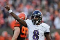 Baltimore Ravens quarterback Lamar Jackson (8) gives a signal during the second half of an NFL ...