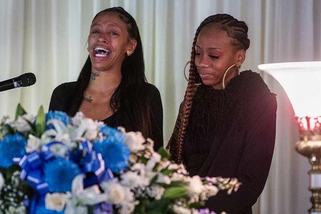 Sisters Ebony Hester and Derryon Burks comfort each other as they talk of wonderful past moment ...