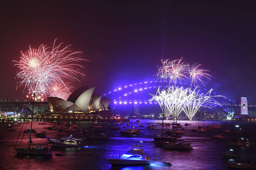 Fireworks are seen from Mrs. Macquarie's Chair during New Year's Eve celebrations in Sydney, Tu ...