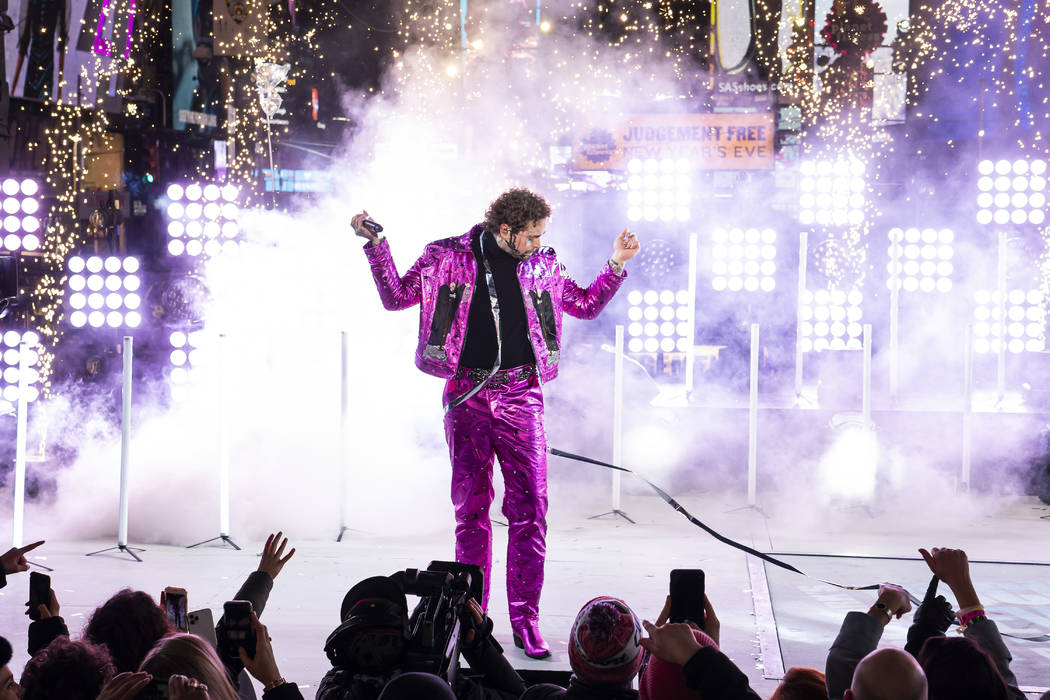 Post Malone performs at the Times Square New Year's Eve celebration on Tuesday, Dec. 31, 2019, ...