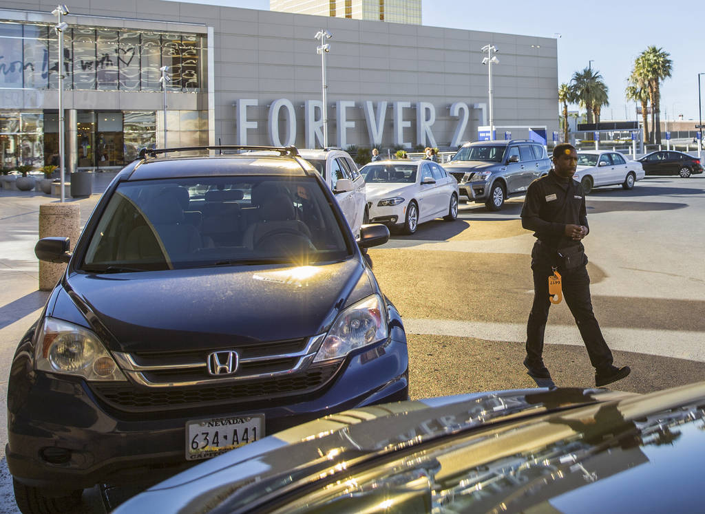 Desean Frazier, right, valets cars outside The Capital Grille on Wednesday, Feb. 27, 2019, at F ...