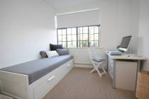 This office can transform into a guest room when needed. (Houzz)