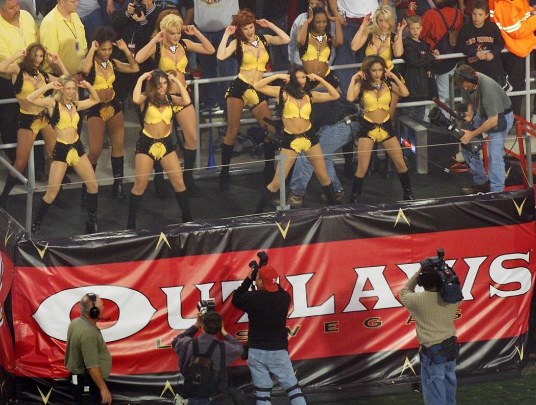 Las Vegas Outlaws cheerleaders entertain the crowd during the XFL's opener at Sam Boyd Stadium ...