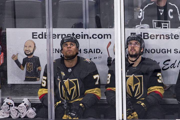 Vegas Golden Knights Ryan Reaves (75) and Tomas Hyka (38) look up from the penalty box during a ...
