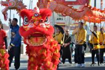 Performers from the Lohan School of Shaolin Kung Fu march in a parade during Chinese New Year c ...