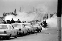 Tear gas fumes fill the air as state troopers, ordered by Gov. George Wallace, break up a demon ...