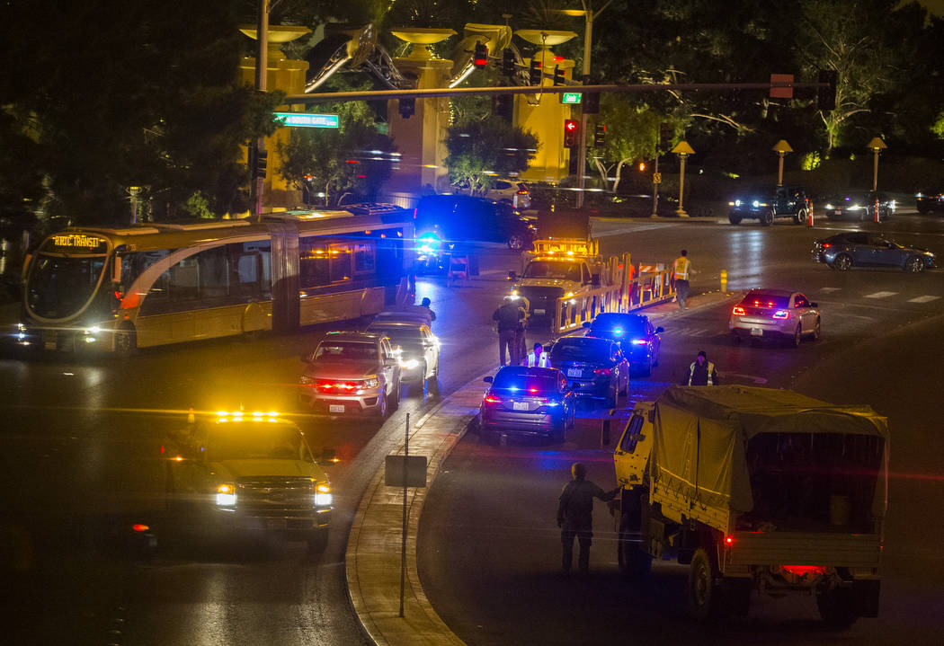 Security forces block off the intersection of Spring Mountain Road and Las Vegas Boulevard Sout ...