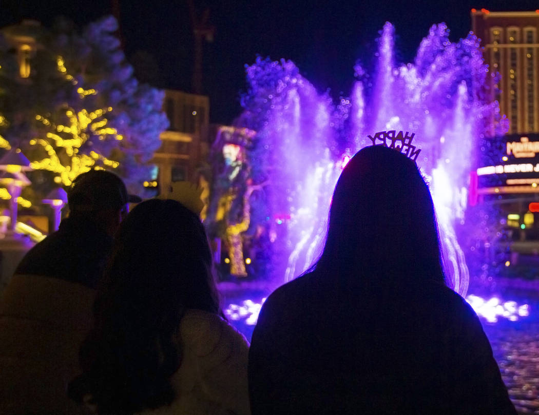 Fatima Peña, from Napa, Calif., enjoys the fountains outside Wynn Las Vegas on the Strip o ...