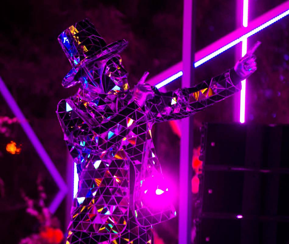 Performers entertain the crowd on the Strip on Tuesday, Dec. 31, 2019, in Las Vegas. (Benjamin ...