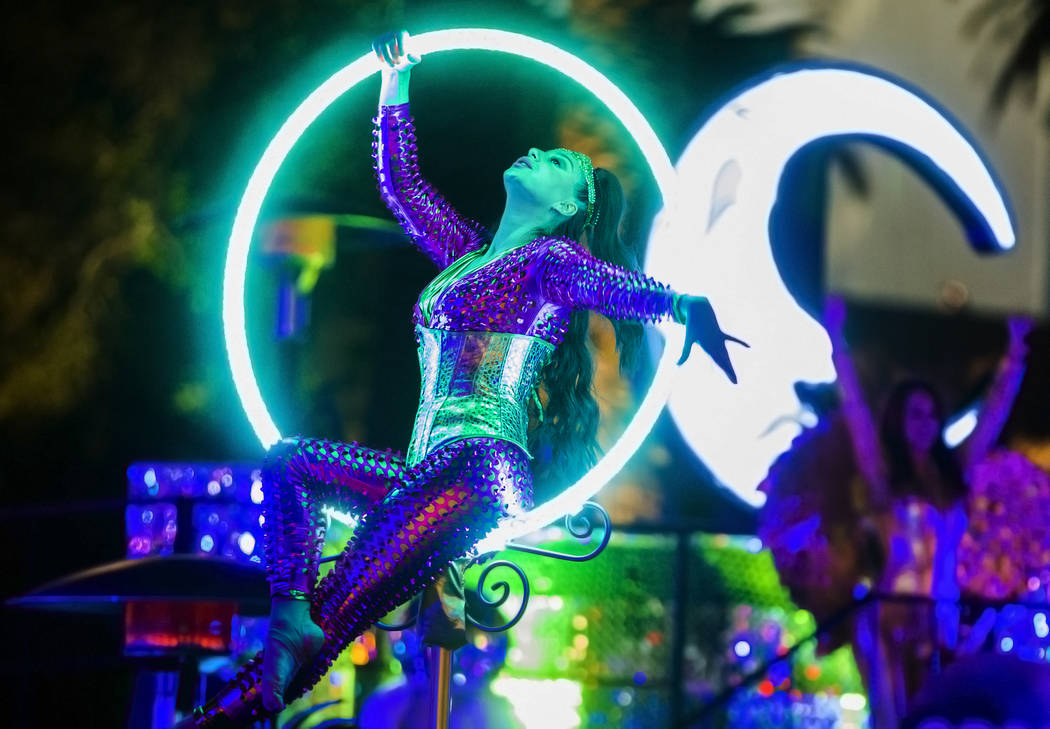 Performers entertain the crowd on the Strip on Tuesday, Dec. 31, 2019, in Las Vegas. (Benjamin ...