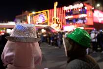Some were bundled up to see the fireworks on the Las Vegas Strip on Tuesday, Dec. 31, 2019, in ...