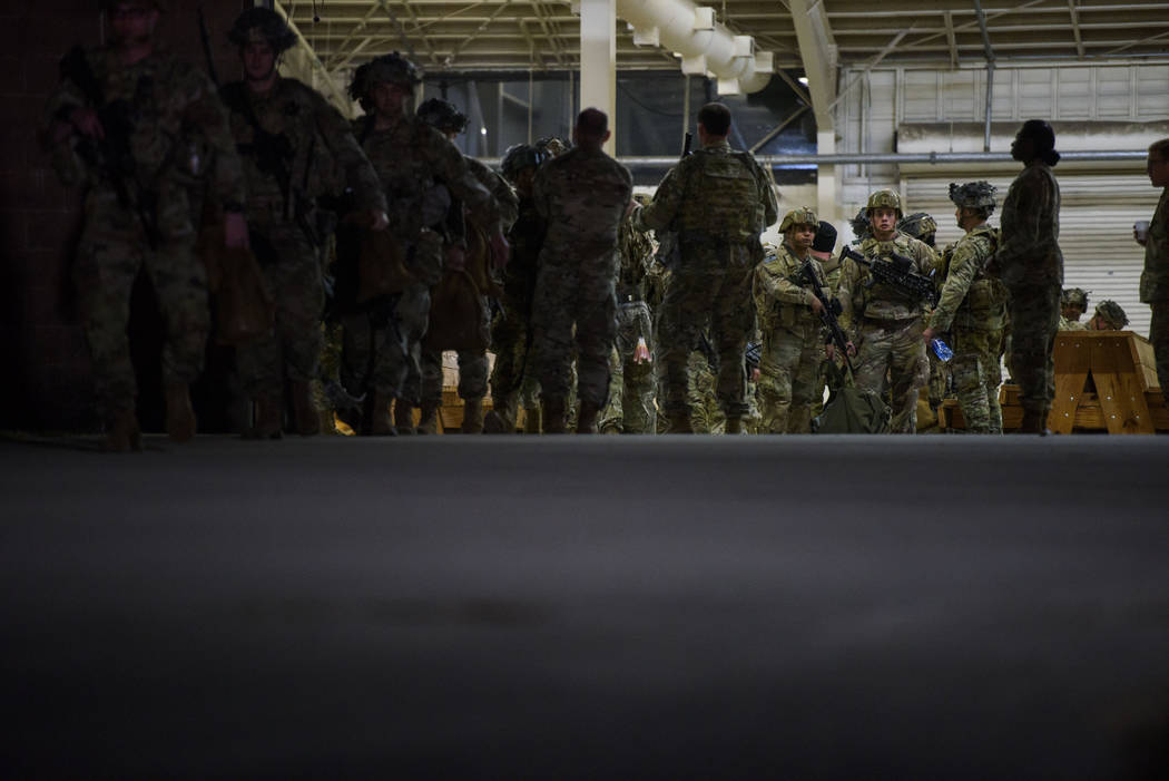Soldiers board a C-17 aircraft Wednesday, Jan. 1, 2020 at Fort Bragg, N.C., to be deployed in I ...