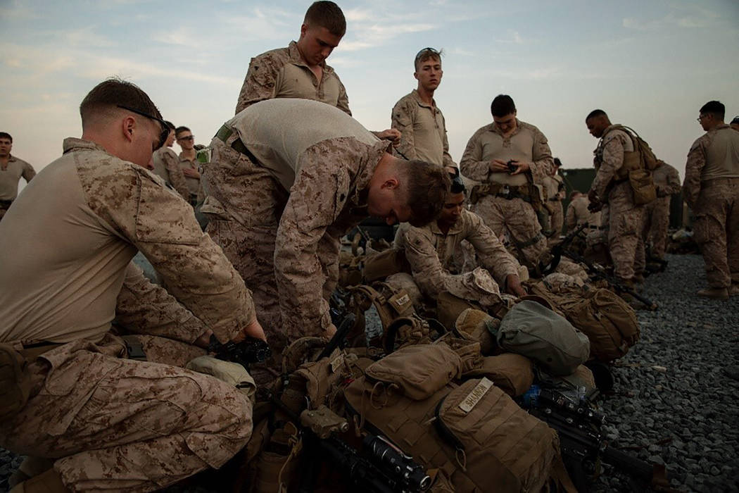 In this photo provided by U.S. Department of Defense, U.S. Marines assigned to Special Purpose ...