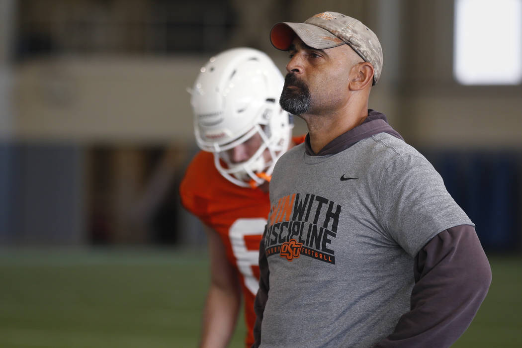 Oklahoma State's Kasey Dunn, associate head coach/receivers coach, is staying at OSU. (AP Photo ...