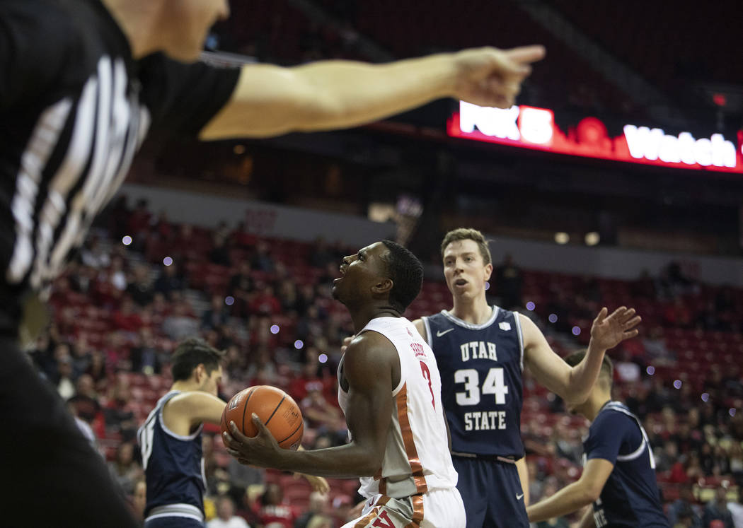 UNLV's guard Amauri Hardy (3) expresses dismay as the referee makes a foul call against UNLV du ...