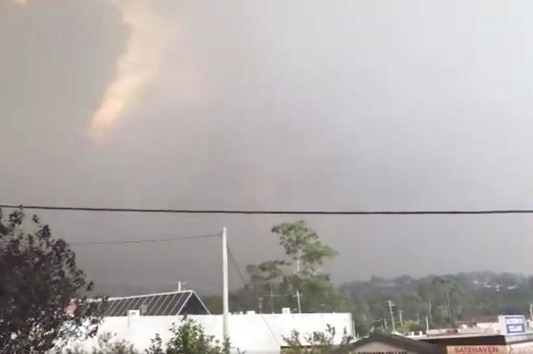 In this Tuesday, Dec. 31, 2019, image from video, fires are seen from Batehaven, near Batemans ...