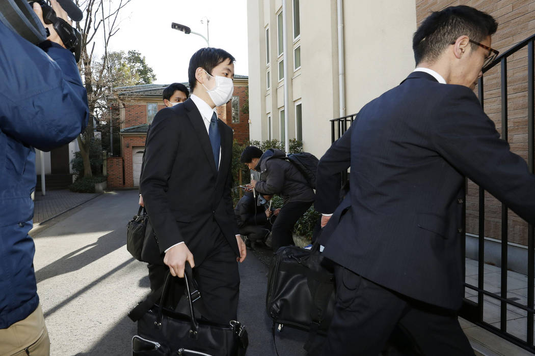 Prosecutors arrives at former Nissan Chairman Carlos Ghosn's residence for a raid in Tokyo Thur ...