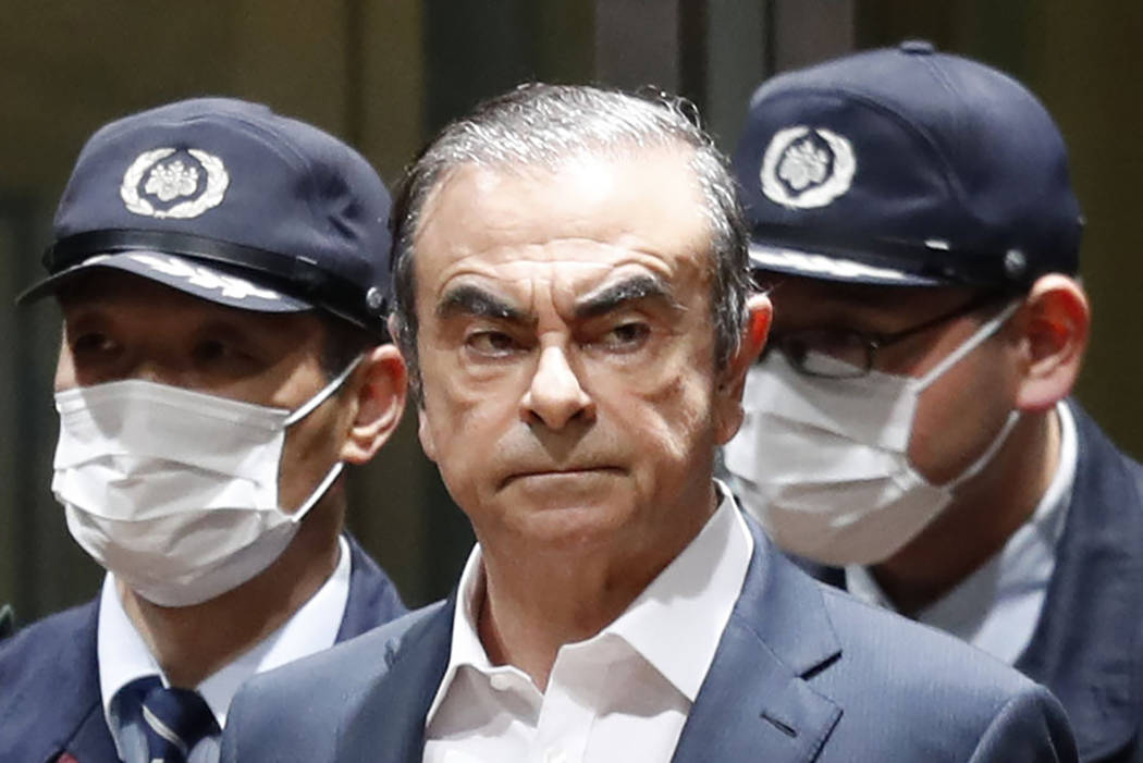 In this April 25, 2019, file photo, former Nissan Chairman Carlos Ghosn leaves Tokyo's Detenti ...