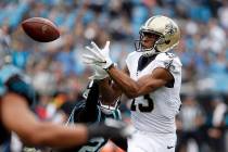 New Orleans Saints wide receiver Michael Thomas (13) reaches for a pass during the first half o ...