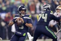 Seattle Seahawks quarterback Russell Wilson drops back to pass against the San Francisco 49ers ...