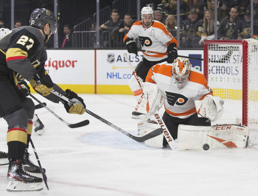 Vegas Golden Knights defenseman Shea Theodore (27) shoots on Philadelphia Flyers goaltender Car ...