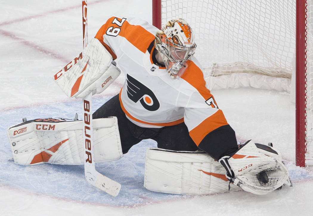 Philadelphia Flyers goaltender Carter Hart (79) makes a save in the third period of an NHL hock ...