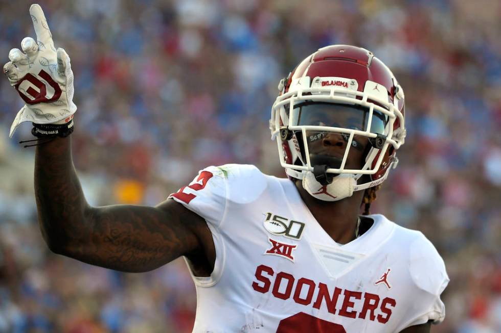 FILE - In this Sept. 14, 2019, file photo, Oklahoma wide receiver CeeDee Lamb celebrates after ...