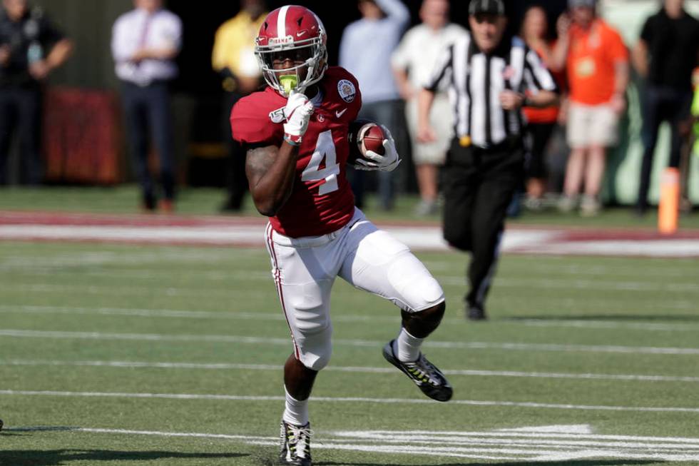 Alabama wide receiver Jerry Jeudy (4) runs after a reception against Michigan during the first ...