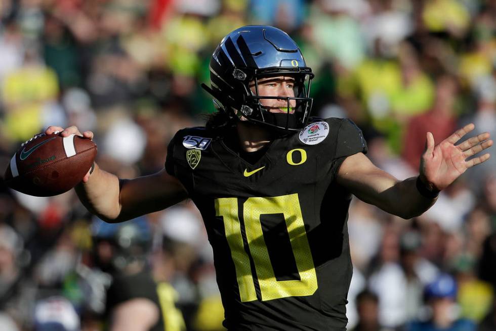 Oregon quarterback Justin Herbert passes against Wisconsin during first half of the Rose Bowl N ...