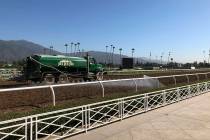 A truck waters the track at Santa Anita Park in Arcadia, Calif., Wednesday, Oct. 30, 3019. (AP ...