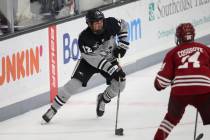 Providence's Jack Dugan (12) with the puck during an NCAA hockey game against Colgate on Friday ...