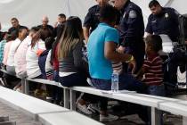 In this Sept. 17, 2019, file photo, migrants who are applying for asylum in the United States g ...