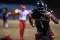 Desert Pines' Darnell Washington (1) makes way to the end zone as Arbor View's Rickie Davis Jr. ...