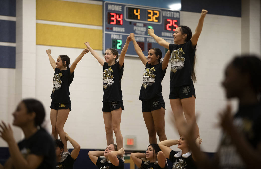 Spring Valley High School cheerleaders perform during the girls basketball game against Desert ...