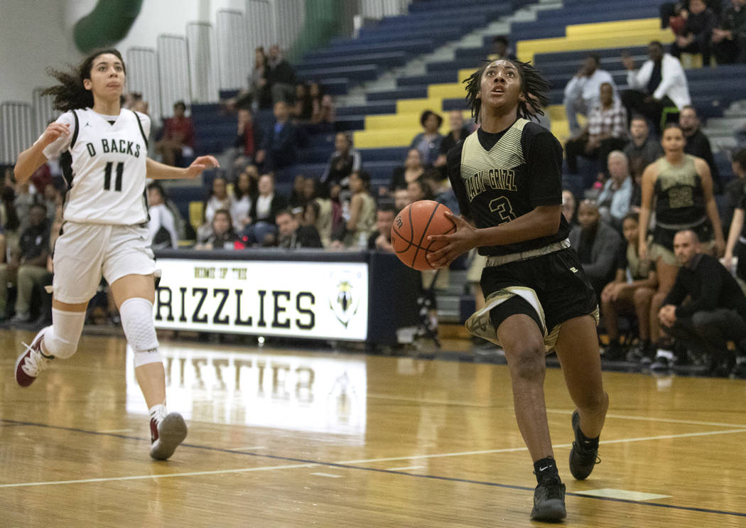 Spring Valley's forward Aaliyah Gayles (3) runs to make a point as Desert Oasis's forward Olivi ...