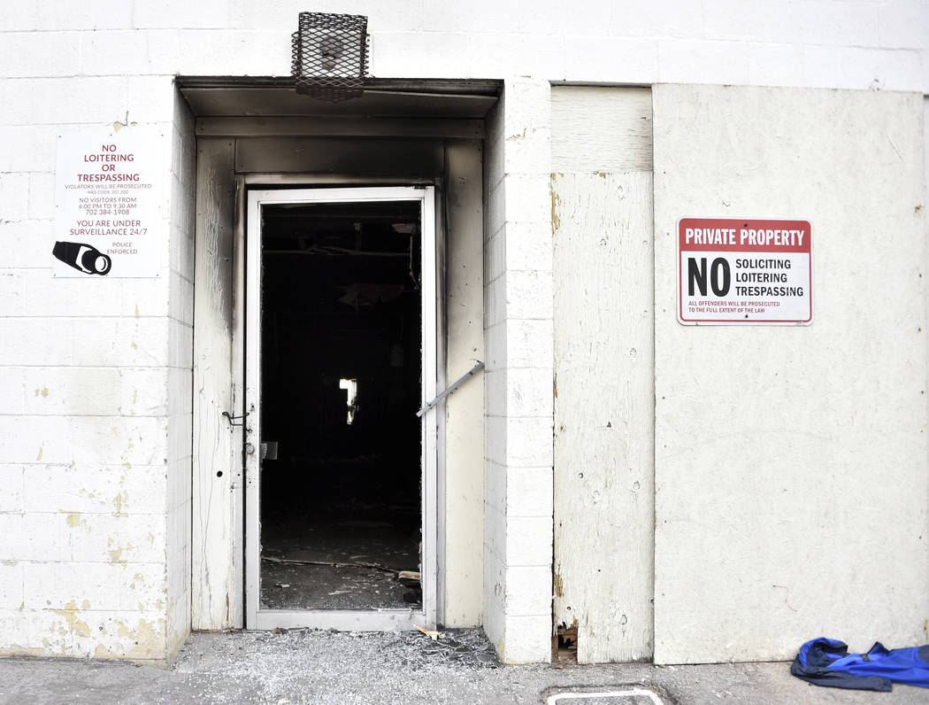 Soot darkens the backdoor of a three-story apartment complex Saturday, Dec. 21, 2019 in Las Veg ...